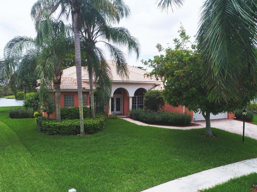 Stunning much sought after Monterey Model. This home is a MUST SEE. It is totally updated and upgraded. Freshly painted in pleasing neutral colors. The kitchen is recently updated with customized cabinets and high-end appliances. Solid hardwood flooring in the master suite and new carpet through out the other 3 bedrooms.Custom stained shutters in living and dining rooms and wood blinds through the home. New hurricane proof garage doors to match the new full house Accordion shutters. Granite counter tops and custom Thomasville cabinets in the laundry room. Beautiful Lake View and much more. This home is located in the high-end community of Boca Falls and convenient to everything. All schools are 'A'rated. This beautiful home will not last!