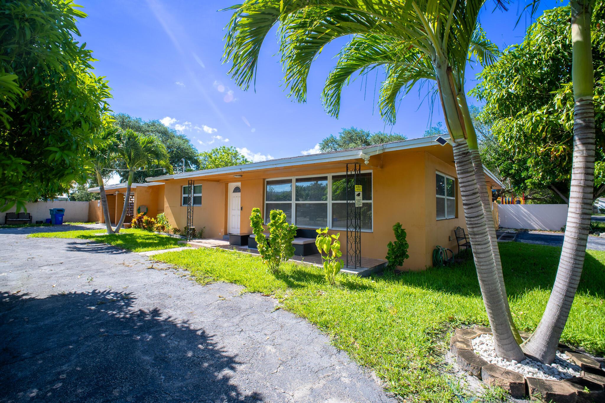 Beautifully updated 3BR/2.5BA home featuring a 2017 roof, new A/C and handler, and professionally appraised at $640,000 in June 2025. Includes impact windows, all-new appliances, and a granite kitchen. Two master suites one perfect for an in-law setup plus three elegantly renovated baths. Spacious laundry room with sink, landscaped backyard with covered patio, and ample parking with two covered spaces, storage, circular, and side driveways. While some cosmetic updates are needed, this is a home with great bones and solid construction, offering comfort, value, and potential.