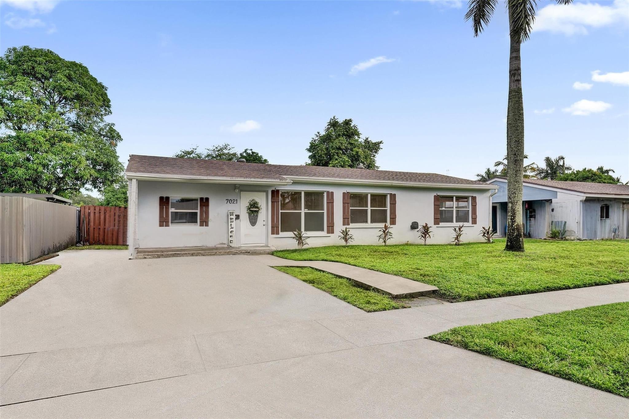 Modern & Updated Home in the heart of Pembroke Pines/Hollywood- this spacious 4 bedroom, 2 bath home is move in ready and beautifully updated. Step inside to find gray plank TILE flooring, freshly painted and textured walls, & elegant crown molding. The kitchen has custom gray cabinetry, decorative backsplash, sleek white counter tops & SS appliances with gas range. A flexible layout with space for the whole family with separate family/bonus room plus a 4th bedroom or office. Interior laundry room with W/D & Workshop/Storage . Newer roof & AC. Enjoy a large fenced backyard w/ covered patio, custom brick BBQ, & double gate access with ROOM FOR BOAT! Located in a quiet neighborhood with NO Hoa. Close to schools, restaurants, Hard Rock Casino & just 20 minutes to Hollywood Beach.