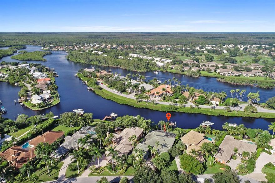 Located in the highly sought after gated community of Jupiter River Estates lies this incredible opportunity to own a beautifully updated home on the Loxahatchee River.  Meticulously maintained, this riverfront home features impact windows and doors, new hardwood flooring throughout, updated kitchen and new baths.  The pool area was made for entertaining with a screened enclosure and a summer kitchen that includes a gas grill, wet bar, built-in ice-maker and a built-in beer keg.  The pool/spa is heated for those cool winter nights.  Out back you will find one of the river's most tranquil canals. The dock includes a 9,000lb lift, fish cleaning station and room for up to a 34ft boat.  Just 20 minutes to the Jupiter Inlet and some of the best snook fishing anywhere in the area.  A must see.