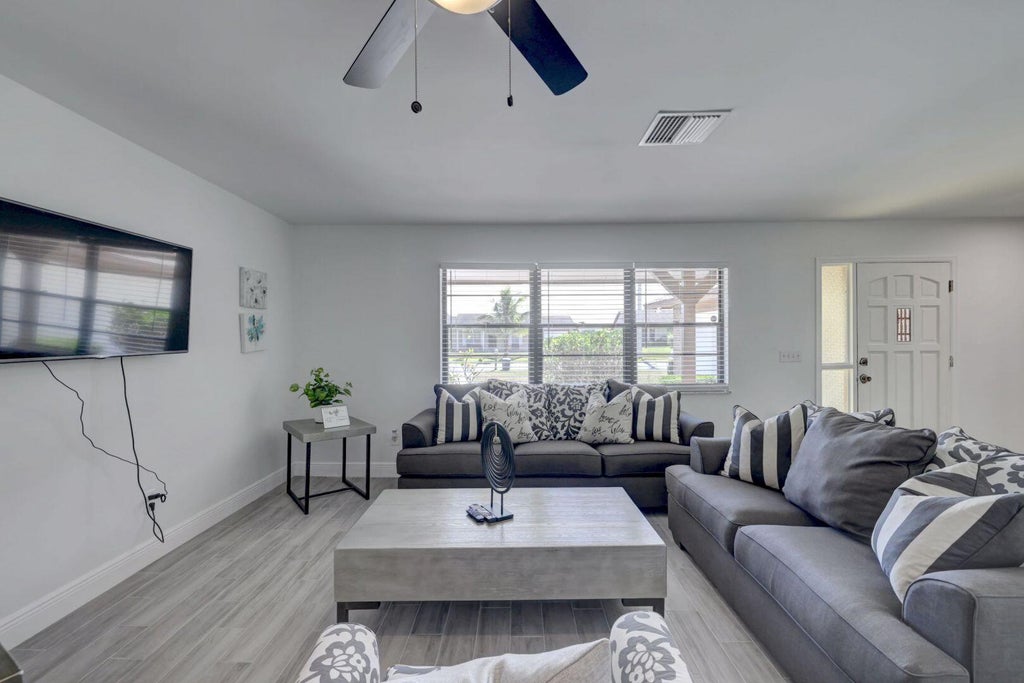 Photo of 543 SE GREENWAY Terrace, Port Saint Lucie, FL 34983 (MLS # B26077867)