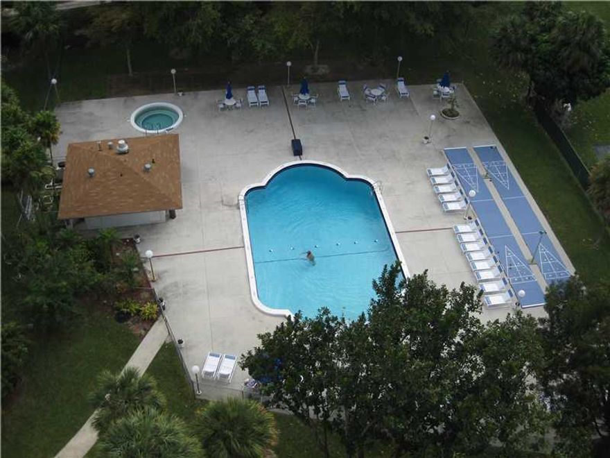 All Ages Welcome! Bright and spacious one bedroom one and a half bath. Wonderful skyline views from this 11th floor unit. Enclosed porch with floor to ceiling sliding glass doors which is great for office/den. Eat-in kitchen. Walk-in closets. Furniture in n cluded in sale.  24 Hour security. Extra storage. Hillcrest is centrally located to I-95, Turnpike, shopping, beaches and Ft. Lauderdale Airport.