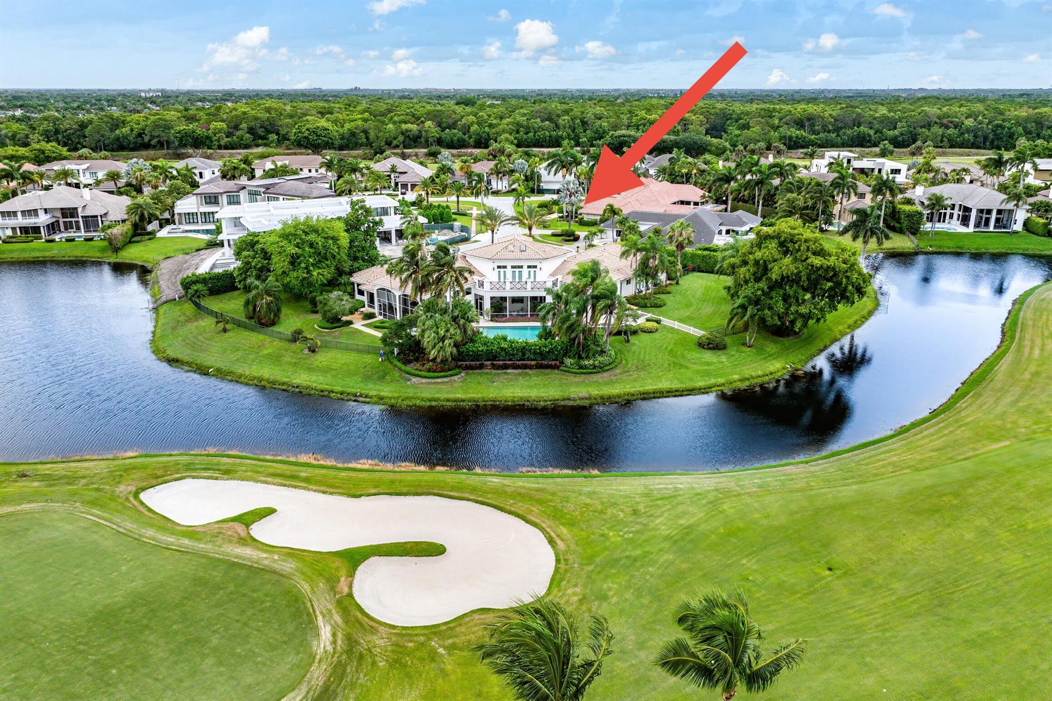 Crown jewel property in St. Andrews Country Club- A double lot at the end of a cul-de-sac, encompassing .86 acres with 280-degree views spanning water and golf course. The views are spectacular from nearly every room. This 7602 sq ft home is exquisitely appointed and exudes an elegance reminiscent of a Palm Beach estate. The home offers 6 bedrooms and 8 and 1/2 baths; a second level VIP guest suite comprising nearly 800 sq ft; a theater; multiple screened-in outdoor entertaining areas; an exceptionally large primary suite that includes two spacious bathrooms each with a large walk-in shower, two large custom closets, and an adjoining office that overlooks the water and has private, outdoor access. All guest suites are ensuite and exquisitely appointed, and all have French Doors leading