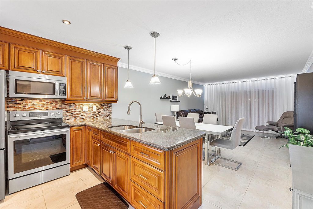 Photo of 5051 W Oakland Park Boulevard #301, Lauderdale Lakes, FL 33313 (MLS # F10512078)