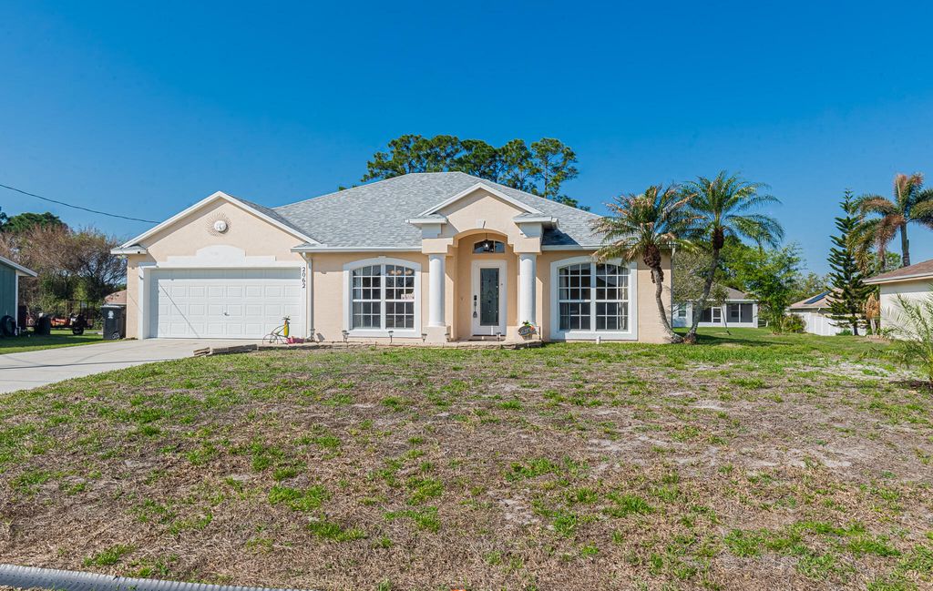 Photo of 2062 SW Idaho Lane, Port Saint Lucie, FL 34953 (MLS # B26007180)