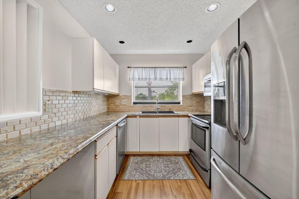 Photo of 6101 SE Landing Way #11, Stuart, FL 34997 (MLS # R11119888)