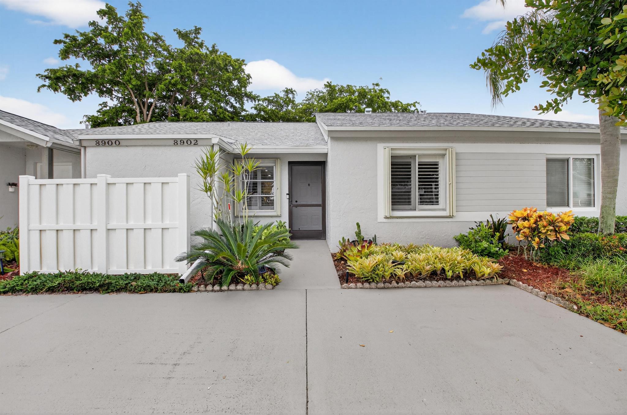 Beautifully updated waterfront villa in Boca Raton's Whisper Walk 55+ community! This move-in ready residence features tile floors throughout, elegant plantation shutters, and a remodeled kitchen with white cabinetry, quartz counters, pull-out pantry, stainless steel stove, and LED lighting. Both bathrooms are tastefully renovated, the spacious master suite offers serene lake views, and an LG washer/dryer adds convenience. Upgrades include all-new ceiling fans, recessed lighting, accordion shutters, new roof, new gutters with leaf filters, freshly painted exterior, and a birdcage roof replaced within 6 months. Enjoy tranquil patio views plus community exercise paths, lakes, and an active lifestyle--minutes to shopping, dining, and beaches!
