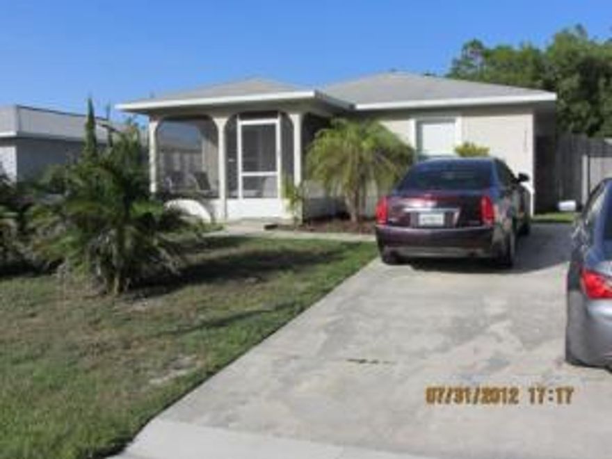 Open the door and enter into an upbeat and contemporary home.  Open floor plan for entertaining with added bonus room that has endless uses. Large fenced backyard with two sheds. Kitchen upgraded and home offers tile and wood flooring. Centrally located home that you can walk to downtown Port Salerno for waterfront dining and local artist areas. Short distance to the beaches or interstate entrance.