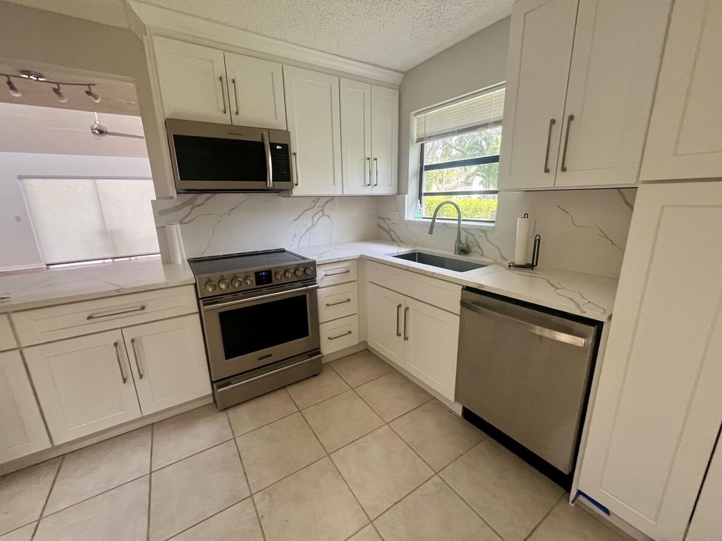 Photo of 491 Deer Creek Wildwood Ln Lane E, Deerfield Beach, FL 33442 (MLS # B26035202)