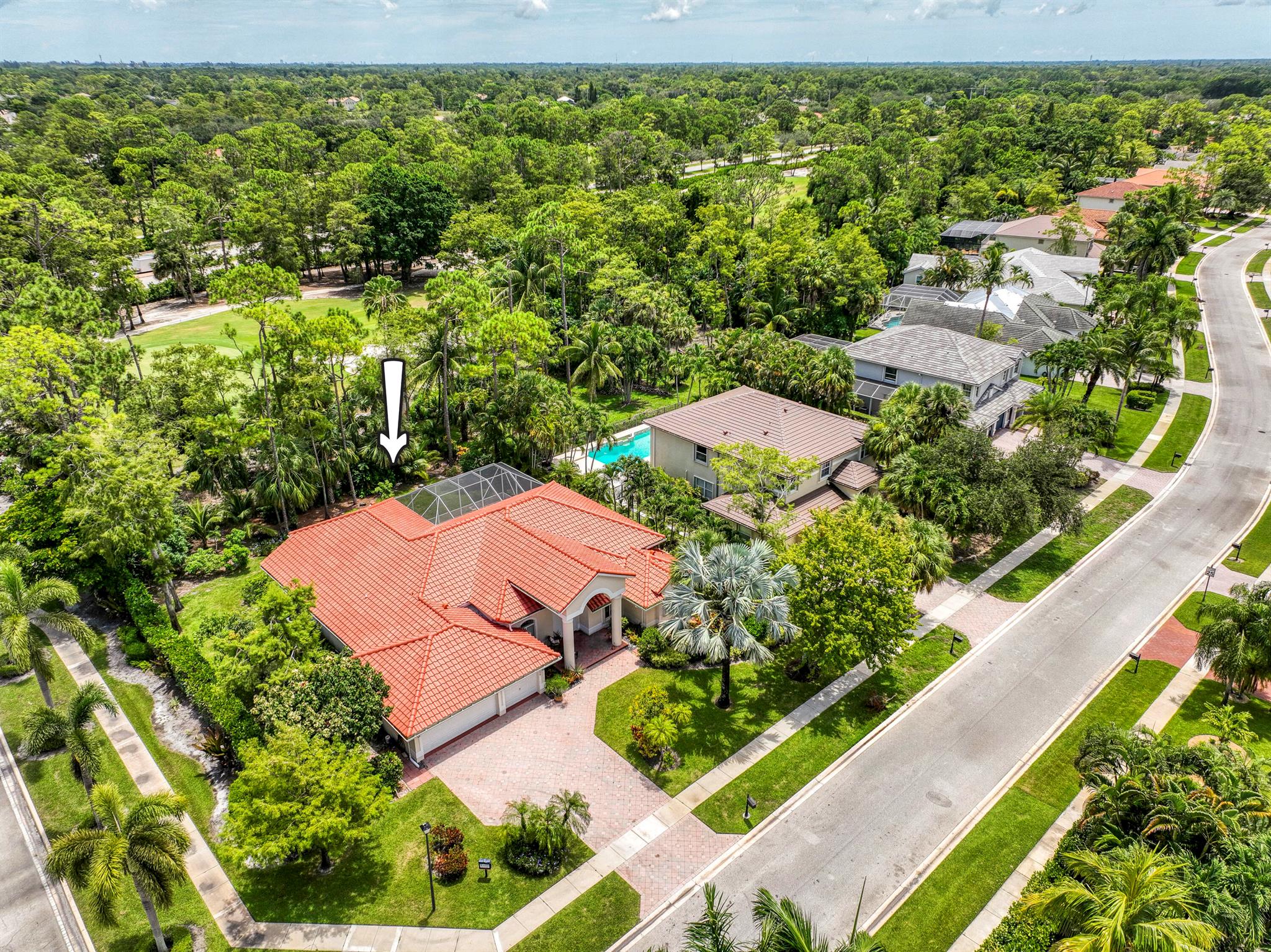 This updated home with NEW ROOF offers an open split floor plan, sleek kitchen with granite counters, upgraded appliances, and new recessed lighting. The master bath is a true retreat, complemented by accordion shutters throughout and lush tropical landscaping. Enjoy outdoor living with a private pool, fruit trees, and green space in a gated community with a virtually manned entrance. Perfectly located near Wellington National Golf Course, shops, dining, and top-rated schools, including Binks Forest Elementary and Wellington Landings Middle.