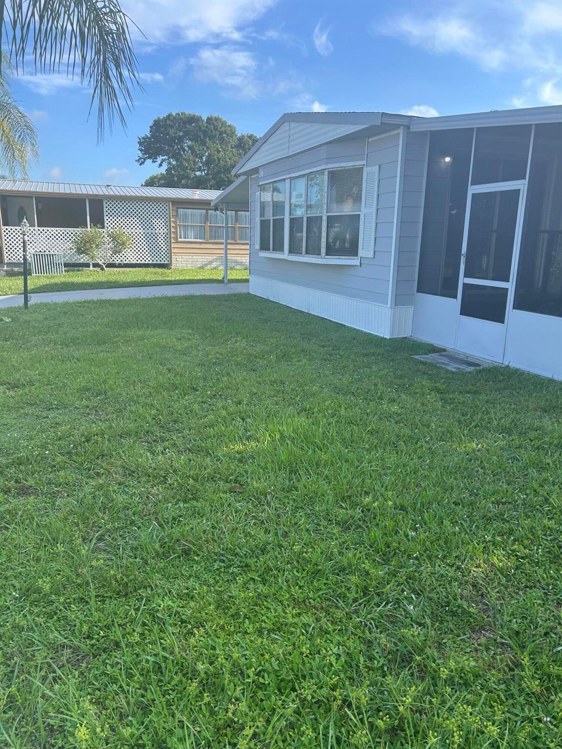 This two bedroom two bath manufactured homes sits on a cul-de- sac in the cozy country club called Spanish Lakes. come enjoy the resort life-style without the resort price. This two bedroom two bath home is in a 55 and older community, for active seniors. newer, air conditioning unit,freshly painted new screen porch, roof is only three years old. they offer golfing seven days per week ,,tennis, swimming pools ,club house activities and much more. see why its worth living here. buyers has to be park approved.