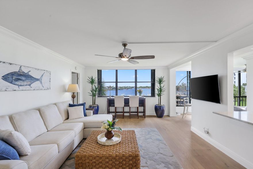 Welcome to this natural light-filled 2 bedroom, 2 bath condo premium middle building in the highly sought-after gated Intracoastal community of Jupiter Cove. This beautifully updated residence offers stunning water and marina views from every room, creating a bright and airy coastal feel throughout. The home features a newly renovated kitchen and bathrooms, stylish upgraded tile and cabinetry, light wash engineered hardwood flooring, sleek roller shades, and fresh finishes throughout. Additional updates include a brand-new A/C (2026), new water heater (2023) making this home truly move-in ready. One covered parking space included + designated outdoor storage shed with space for bicycles. Jupiter Cove offers an exceptional waterfront lifestyle with many amenities including; pickleball, tennis courts, pool, clubhouse, fitness room, and Pelican Park, exclusive to Jupiter Cove residents—complete with grills, a tiki bar, dining areas, and kayak/paddleboard storage right along the Intracoastal. Boating enthusiasts will love the easy access with no fixed bridges and the Jupiter Inlet just minutes away. Boat slips are available for lease or purchase. Ideally located close to waterfront restaurants, shopping, pristine beaches, and PBI Airport—this is South Florida living at its finest.