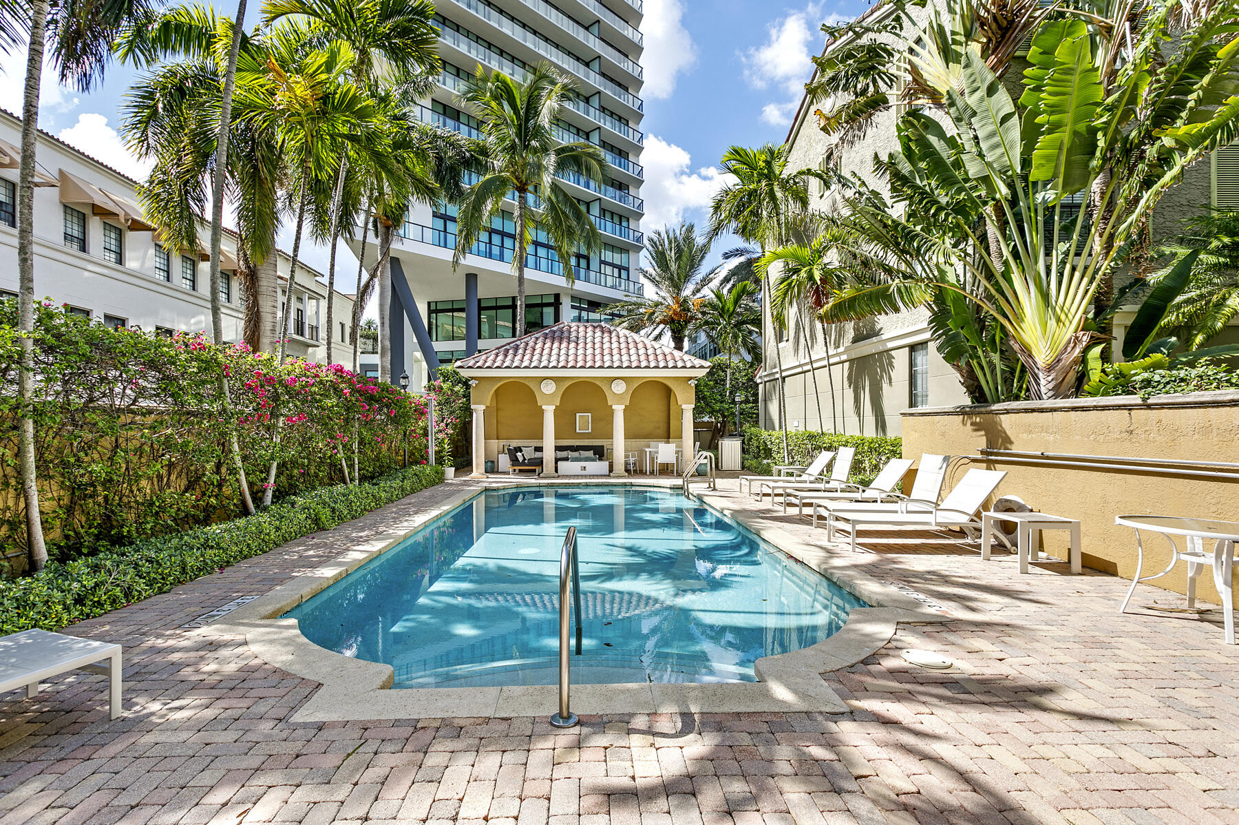 Wonderful CitiPlace location! Walk out your door and be in the middle of all that West Palm Beach has to offer - including great restaurants, many shops, gyms, a Publix, office towers and more! This 3 story townhome is freshly painted and has gleaming marble floors throughout. !st floor has an office/den/bedroom with a powder room and direct access to your own private 2 car, gated garage. 2nd floor - large living room, dining room and an open kitchen with laundry.3rd floor is the primary suite with a large bedroom with built-in shelving, walk-in closet and a full bath, and there is a second en-suite bedroom with a full bath. And the community has a gated, community pool too!