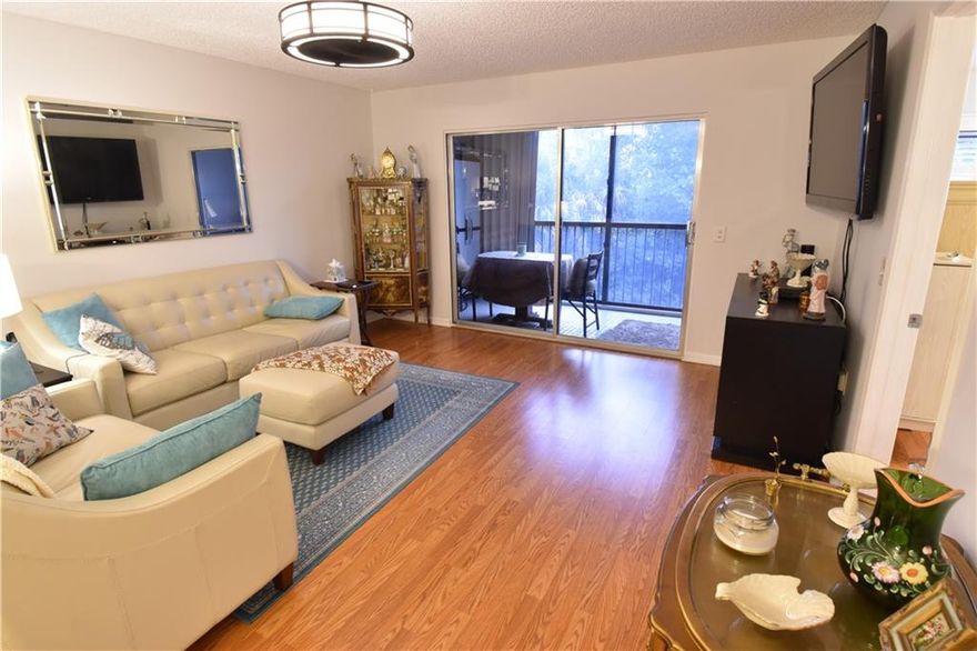 Come and visit this lovely 3rd-floor unit that has no building or neighbors in the back. Enjoy a quiet serene view. Enjoy this completely updated unit with a newer A/C, tankless water heater, updated kitchen with stainless steel appliances, and updated bathrooms with a beautiful master bathroom. Laminate floors throughout. Newer ventless dryer/washer. The unit has hurricane shutters. Century Village boasts all the amenities including several satellite pools, two main pools, indoor and heated, theater, billiards, tennis, card room, and transportation. Enjoy two entries that are guarded.