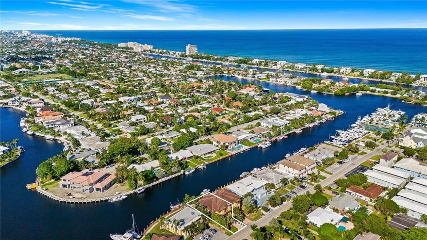 This is a truly rare property.  Located on the widest canal (150') in the Lighthouse Point Marina area. The home features unobstructed waterfront views from the confluence of 6 canals.  Enjoy Intracoastal like views, slow moving boat traffic on the widest canal closest to the Hillsboro Inlet.  The property is walled in for privacy.   3 blocks to the Marina and restaurant. Pool was totally redone approx. 4 years ago along with Dock and Pavers. Car lift is included! This property is a must see opportunity to own a large, newer high ceiling home in Lighthouse Point. It has all the features you would expect in an Estate home with finishes that include Marble floors, Granite counter tops, stainless steel appliances, a very large media room and a plethora of windows! New Elec. Pool Heater