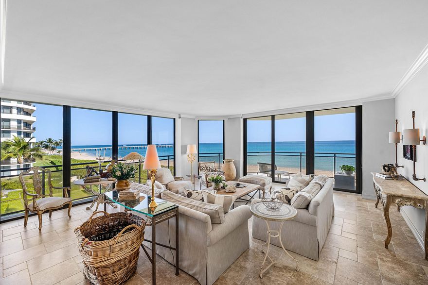 Experience coastal living at its finest in this meticulously maintained corner residence at the Palm Beach Hampton. You'll enjoy direct ocean views from every single room, all framed by stunning floor-to-ceiling glass. This pristine 2-bedroom, 2.5-bath home is filled with natural light and features an open floor plan with high-end finishes, custom millwork, and beautiful Jerusalem Stone flooring.

Relax on your deep, wrap-around terrace or retreat to the spacious owner's suite, which offers a spa-like bath and large walk-in dressing rooms. As a resident, you'll enjoy world-class amenities including a 24/7 gatehouse, fitness center, pool, tennis & pickle-ball. This pet-friendly home is truly move-in ready and includes two assigned garage spaces.