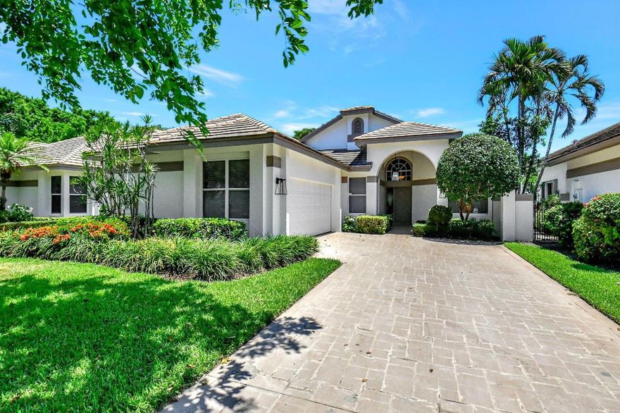 Located in the prestigious Broken Sound Club, you will want to call this ranch style Whisper Trace property with stunning golf course views home. You'll love the split bedroom floor plan with vaulted ceilings, porcelain tile floors and floor to ceiling windows that allow an abundance of natural light shine through making this home warm & inviting. The spacious kitchen is equipped with stainless appliances, custom cabinets, plenty of counter space & nice eating area for 4.  The primary suite with vaulted ceilings features a large walk-in closet and en suite bath with bright skylight, large soaking tub, and separate shower. Step outback to enjoy the Florida sunshine while cooling off in your private pool and get that true country club feel with your club course golf views.