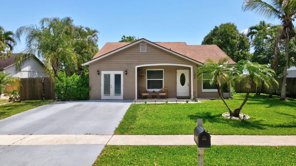 Photo of 1392 Thornridge Lane, Royal Palm Beach, FL 33411 (MLS # B26021707)