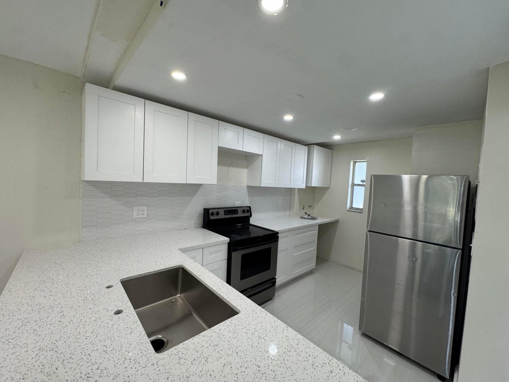 Photo of 8000 FAIRVIEW Drive #209, Tamarac, FL 33321 (MLS # B26073005)