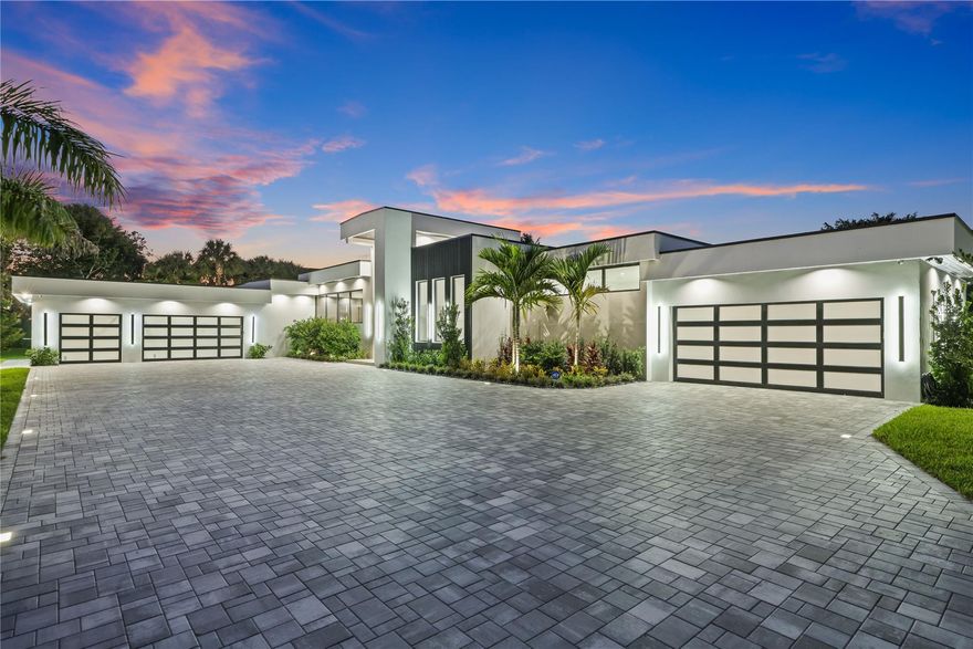 ABSOLUTELY STUNNING! This one of a kind home is 7,000+ sq ft under air modern new construction estate sits on over an acre in one of Parkland’s most private and soon to be gated communities with just six exclusive homes in total. This property is on MUNICIPAL WATER AND SEWER, a rare and valuable upgrade. 5 CAR GARAGE. Triple split floor plan with 5 bedrooms, a large game room, and an expansive open concept layout. The resort style outdoor living space features a massive covered patio, summer kitchen, wet bar, and an oversized heated pool with a spa, three waterfalls, and a dramatic fire feature. A hidden gem offering true privacy, striking design, and modern convenience in a highly sought-after Parkland location.