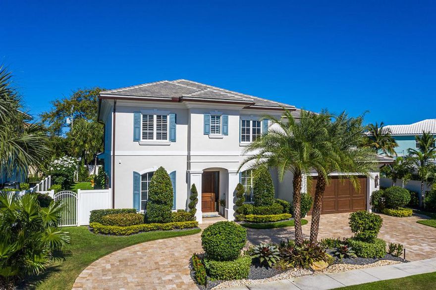 325 NE 7th Street is offered fully furnished; a coastal inspired custom estate home located in the highly sought after Mizner Park neighborhood in East Boca. Built by renowned J.P. DiMisa Luxury Homes, Inc., this home is of exceptional building quality, with no feature or upgrade spared. Decorated and designed by Ava Gray Interiors, situated steps from the shopping and dining of downtown, the beaches, Mizner Park, and the world-class Boca Raton Resort & Club. Featuring 5 bedroom suites plus club room, 4 full baths, 3-car garage, 4,010 living sq. ft., and white-washed oak hardwood floors throughout. The open floor plan includes a symmetrical foyer entry with elegant wainscoted stairway, formal dining room with paneled mirrored accent wall, custom millwork, pool views, custom library/office with built-ins, and an elegant club room and bar with connected temperature controlled custom wine room, with glass viewing wall and LED adjustable lighting. The spacious gourmet kitchen includes top-of-the-line integrated appliances, custom white wood cabinets, large center islands, and premium quartz counters and integrated backsplash. This home was made to entertain inside or outside with its open plan and stunning backyard with covered terrace. The summer room is fully equipped with television, in-ceiling speakers, a built in outdoor kitchen with natural gas BBQ, intimate seating area with stacked stone feature wall, and an alfresco dining space. The heated pool/spa is surrounded by a gorgeous marble deck, and a hardscape lounge chairs sunning area. The strikingly oversized large yard has professionally designed and meticulously maintained landscaping with premium artificial turf in both the front and oversized and useable side yard. A custom-built organic garden, featuring a vertical planter wall is a great place to grow your own Florida fruits and vegetables. Additional premium features include hurricane-resistant construction, landscape feature lighting, custom garage with built-in storage and epoxy flooring, EV charging station, and Control4 smart home automation, with integrated iOS based iPad wall controls for ease of use and adding addition technology. For peace of mind, A 22 KW backup residential generator also serves the home as a powerful and reliable source of backup electricity during an outage.