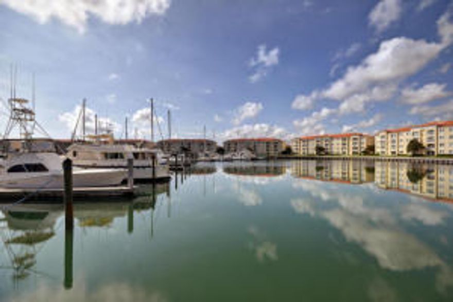 Gorgeous wide intracoastal water views and evening sunsets from this well priced 2/2 condo in Harbour Isle West. Ready to move in and best value for waterfront views. 1st floor unit offers 10' ceilings, granite counters, bonus room, master suite with walk in closets, closet organizers, dual vanities, Roman tub, separate shower. Eat in kitchen, 42'' cabinets and pantry. BRAND NEW carpet as of 11/12/15. Amenities galore offered in Harbour Isle, clubhouse with community room, gym, outdoor grills, heated pool and spa, dog park, car wash area and more! Just minutes from downtown activities, inlet beach area and the ocean, as well as a variety of restaurants and other shopping. Best buy on South Hutchinson Island.