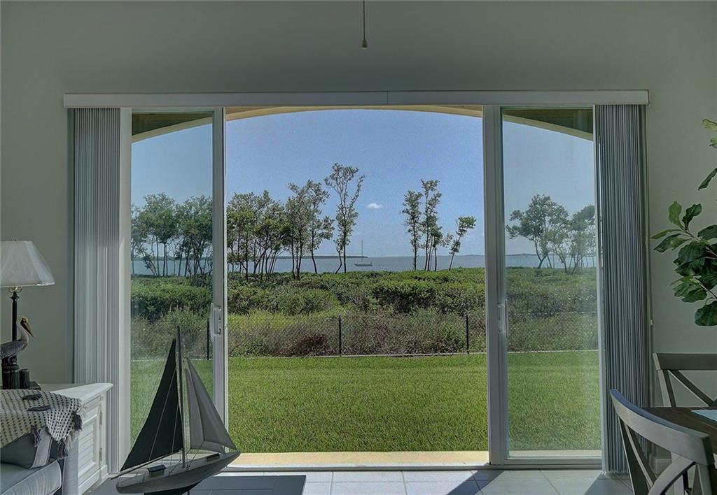Beautiful first floor condo upgraded with hard surface flooring. 2/2 with den, Florida Room, Laundry room, almost 2000 square feet of living space and 10' ceilings!! Feel free to walk outside your Florida Room and enjoy the peaceful sounds of the Indian River Lagoon. No smoking and no pets. Available June 1. Live the island life!