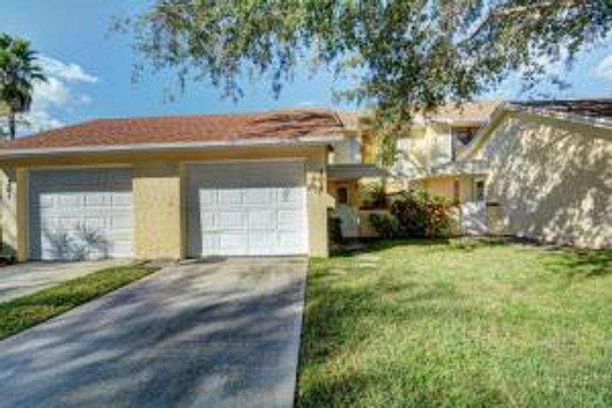 Open, bright and spacious townhome in quiet central community - Joggers Run. New stainless fridge, stove and micro wave. New washer and dryer. Tile throughout main living space. New carpet in bedrooms. Fresh neutral paint throughout. Recent AC (11/15) and hot water heater. Move-in ready. Potential for 3rd bedroom. Accordion shutters. Lake view. Community amenities include pool, tennis, basketball and tot playground. Well located with easy access to schools, shopping, beaches and highways.