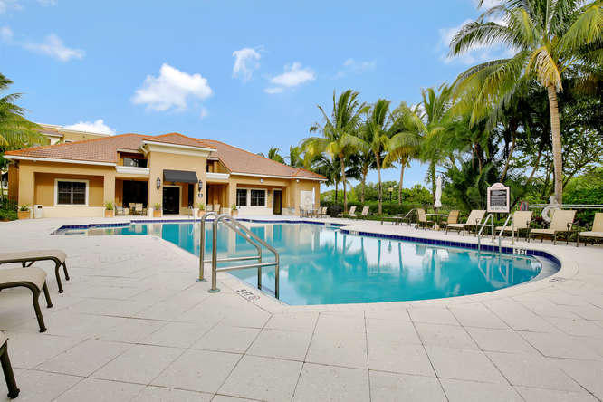 Beautiful split plan 2 bedroom condo, with a covered parking space in the garage steps away from the unit. Additional outside parking space. Ceiling fans, crown molding and impact windows. All tile floors, Kitchen has granite counters and stainless steel appliances. Unit is on the first floor for easy access and faces the tropical courtyard. Master Bedroom has a King size bed. Large TVs in Living Room and Master. Master Bath has separate shower and tub and two sinks. Second bath has large shower. Midtown has a beautiful clubhouse, with exercise room, business center, heated pool/spa and tennis courts. All of this is a secure gated building close to restaurants, groceries, I-95 and the Turnpike.