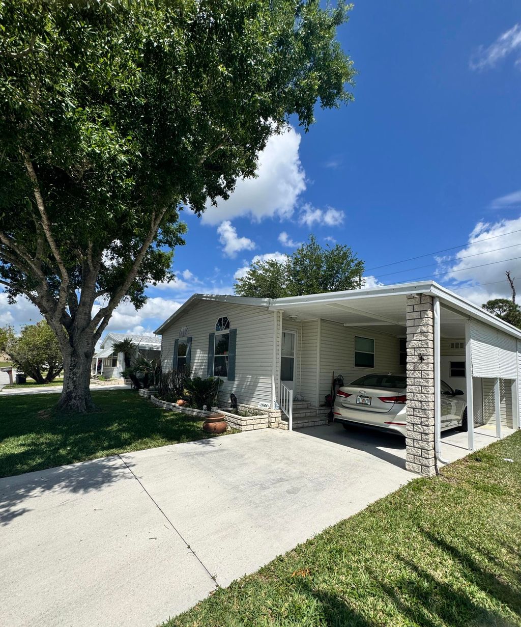 Photo of 15146 Aguila Avenue, Fort Pierce, FL 34951 (MLS # B26022399)