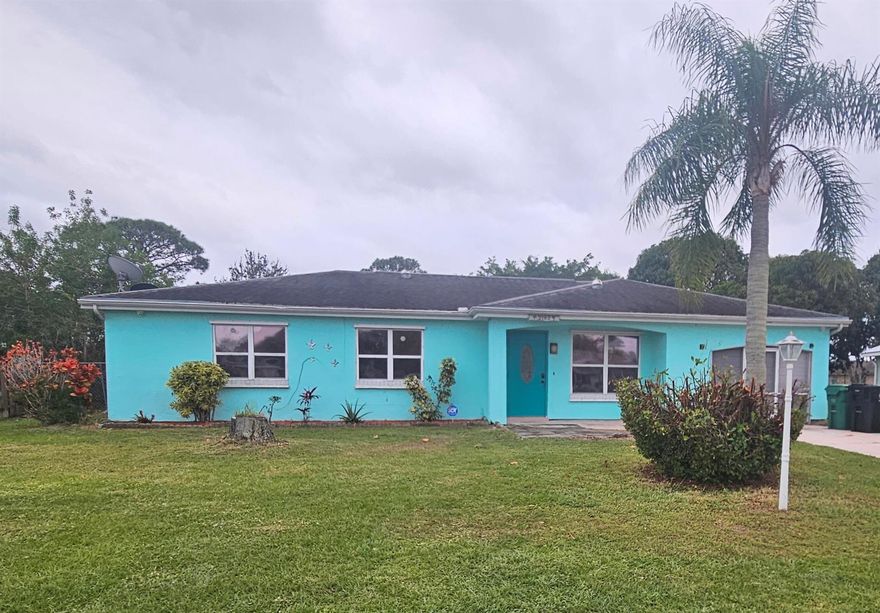 3/2 frame stucco house with a very oversized backyard fenced in with a shed. Home is freshly painted inside but needs some TLC.