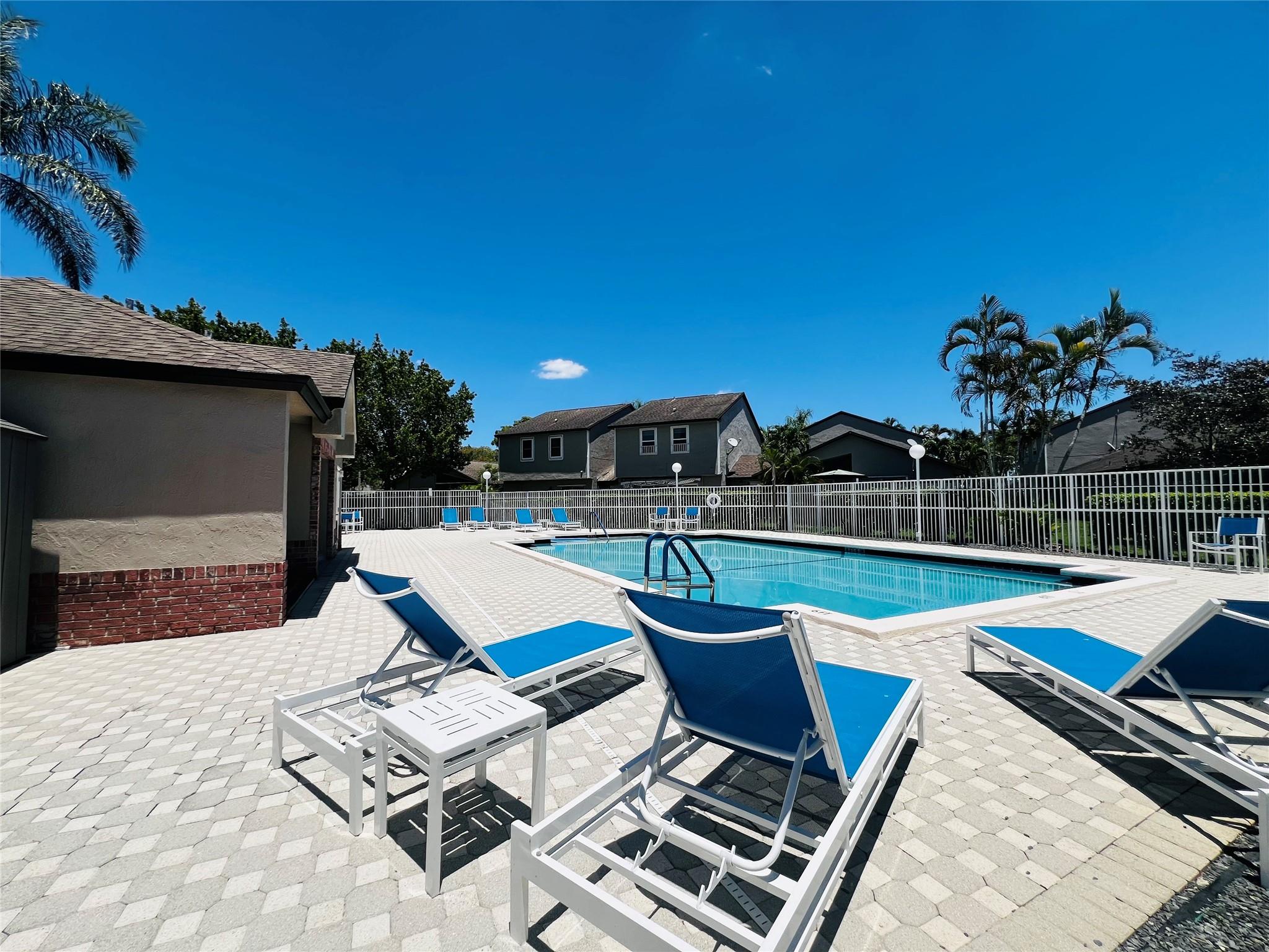 Don't miss this Deal! Price reduced $10,000 and the seller is offering $5000 buyer credit. Spacious 3-bed, 2.5-bath townhouse offering comfort, privacy, and value. Enjoy a large open-concept main floor with a kitchen that connects to both a breakfast nook and dining area. All bedrooms are upstairs with updated bathroom vanity and new blinds. No shared walls—units separated by large storage rooms. New A/C and dryer (2024), full-size washer/dryer included. Full hurricane protection with impact front and storage doors. Steps from the community pool and minutes to parks, shopping, and Sunrise Athletic Complex. Quick access to Sawgrass Expressway. Rent right away. Low HOA includes insurance. One pet allowed. Don’t miss this opportunity!