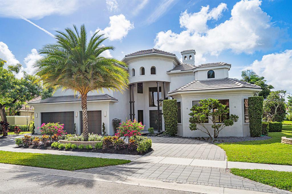 Sited in the prestigious Hamptons of Woodfield Country Club, this custom-built, lakefront home offers 7 bedrooms and 7.1 baths. The Zen inspired entryway includes a walk over bridge complemented by a koi pond and soaring wood beams. Upon entering the home you are greeted by sprawling lake views and the sparkling infinity pool. The living space boasts luminous natural light and streamlined details including a floor to ceiling stone fireplace. Kitchen includes stainless steel appliances, gas-range, double wall oven, cabinetry with glass inserts, and a spacious island, equipped with wine fridge and inset sink. The first floor Master Bedroom features his and her separate baths and gracious walk in custom closets. Additional rooms on the first floor include the massive office with built-ins