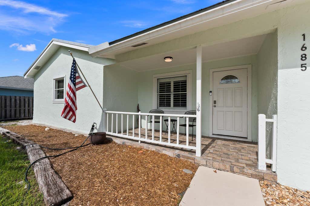 Photo of 1685 NE Darlich Avenue, Jensen Beach, FL 34957 (MLS # R10999730)