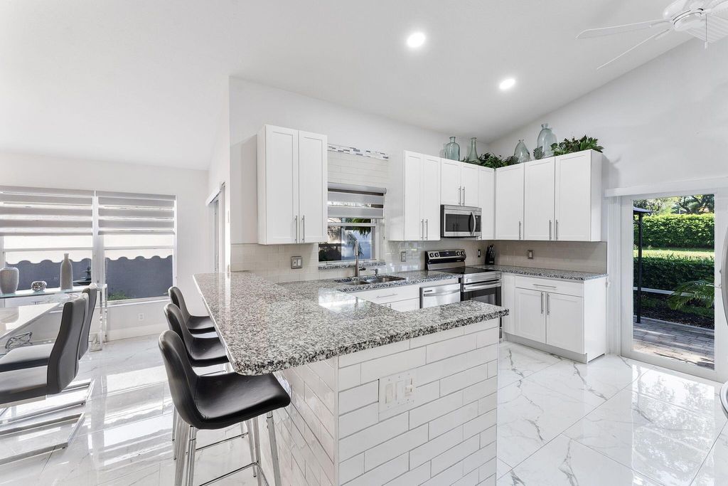 Photo of 7143 Whitfield Avenue, Boynton Beach, FL 33437 (MLS # R11113298)