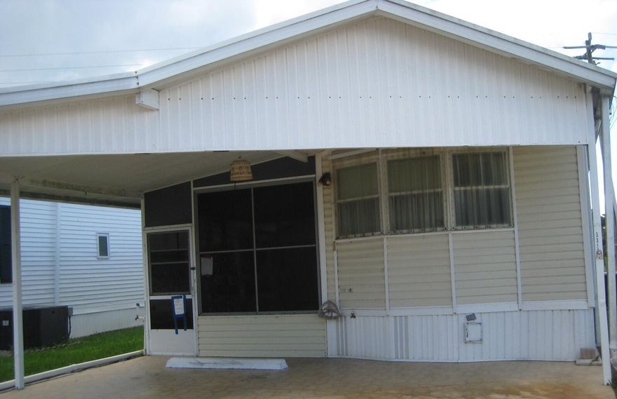Manufactured home in the desirable 55+ gated community of Ancient Oaks RV Resort in Okeechobee, featuring an enclosed patio for extra living space, serene pond views, and backyard privacy. You own the land it is on. Low HOA fees (under $220/month) include water, sewer, cable, lawn care, clubhouse, pool, and more. Community amenities, a heated pool & spa, marina with boat docks and ramp, shuffleboard, laundry facilities, recreational hall with library, bingo nights, and a fitness room. Storm shutters provide added peace of mind, making this an ideal seasonal retreat or year-round residence. Buyer to verify all MLS information, measurements and HOA information.