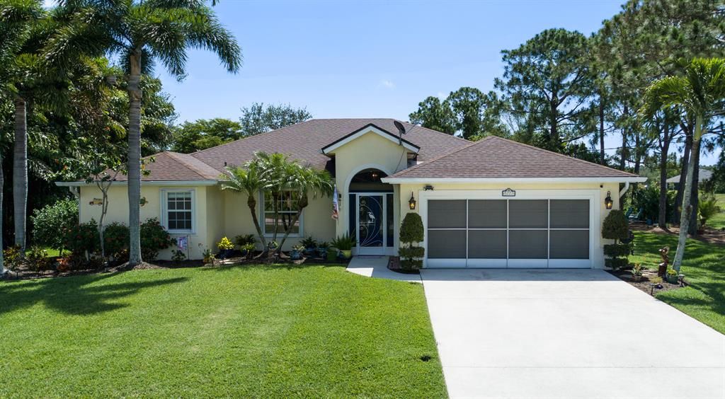 Photo of 5777 NW Cleburn Drive, Port St Lucie, FL 34986 (MLS # R10891107)