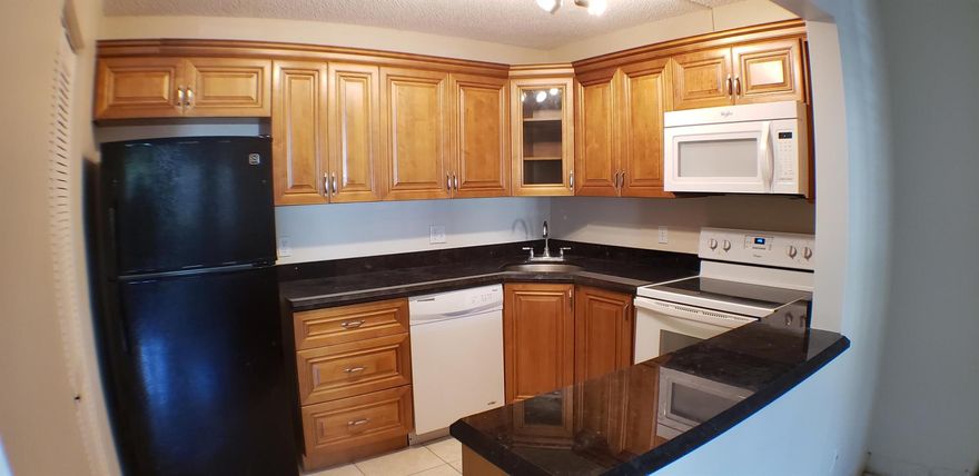 THIS BEAUTIFUL, BRIGHT AND SPACIOUS 1ST. FLOOR CONDO OFFERS YOU MANY RENOVATIONS, CUSTOM KITCHEN WITHGRANITE COUNTERTOPS, NEW FLOORING , PAINTING, TANKLESS WATER HEATER AND HURRICANE SHUTTERS, A MUST VISIT. It's located in asecluded Court (Dead End), very quiet and no traffic. 2 BEDROOM 1 BATHROOM CONDO READY TO MOVE IN TODAY! Full Washer and dryer . plus laundryroom area. All ages and pet friendly (25 lbs. limit).Excellent location near Turnpike and close to I-95, Cityplace, Ball Park and airport; close to stores and PalmBeach Outlets BRING ALL OFFERS!! NEW A/C UNIT AND UPDATED APPLIANCES! AMENITIES INCLUDE COMMUNITY POOL OVERLOOKING A LAKE,RACQUETBALL, TENNIS, BASKETBALL AND SHUFFLEBOARD! 20 minutes from the Ocean. A MUST VISIT! Landlord is a hand-on individual on maintenance