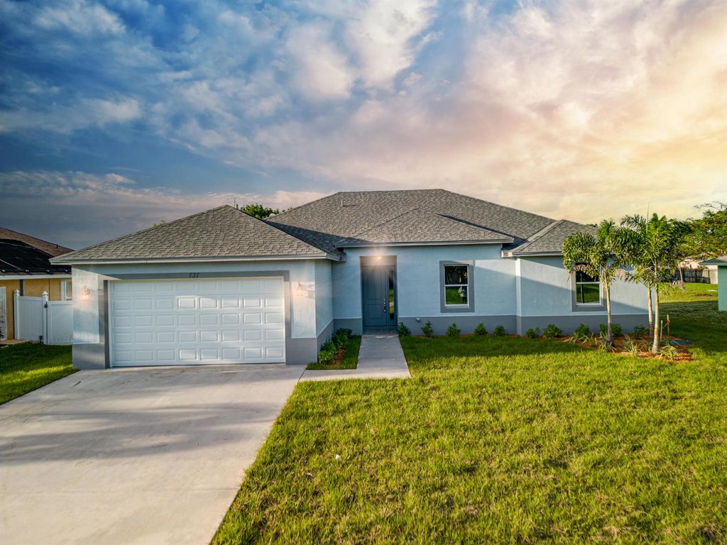 Photo of 1768 SW Aztec Avenue, Port St Lucie, FL 34953 (MLS # R10884725)