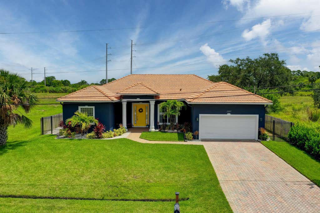 Photo of 2207 SW Salmon Road, Port Saint Lucie, FL 34953 (MLS # R10907295)