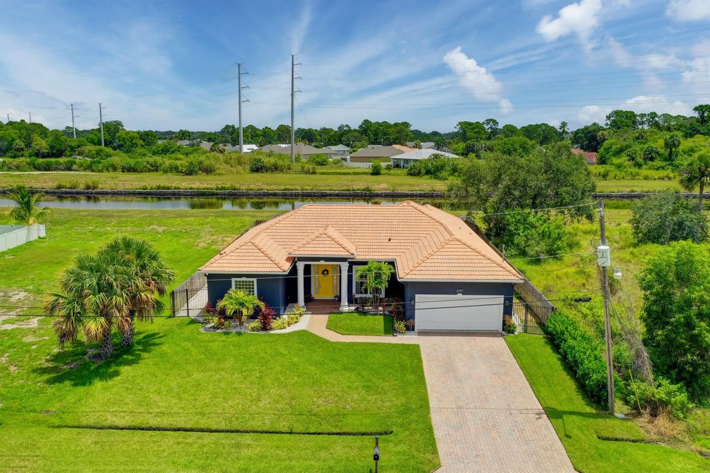 Photo of 2207 SW Salmon Road, Port Saint Lucie, FL 34953 (MLS # R10907295)