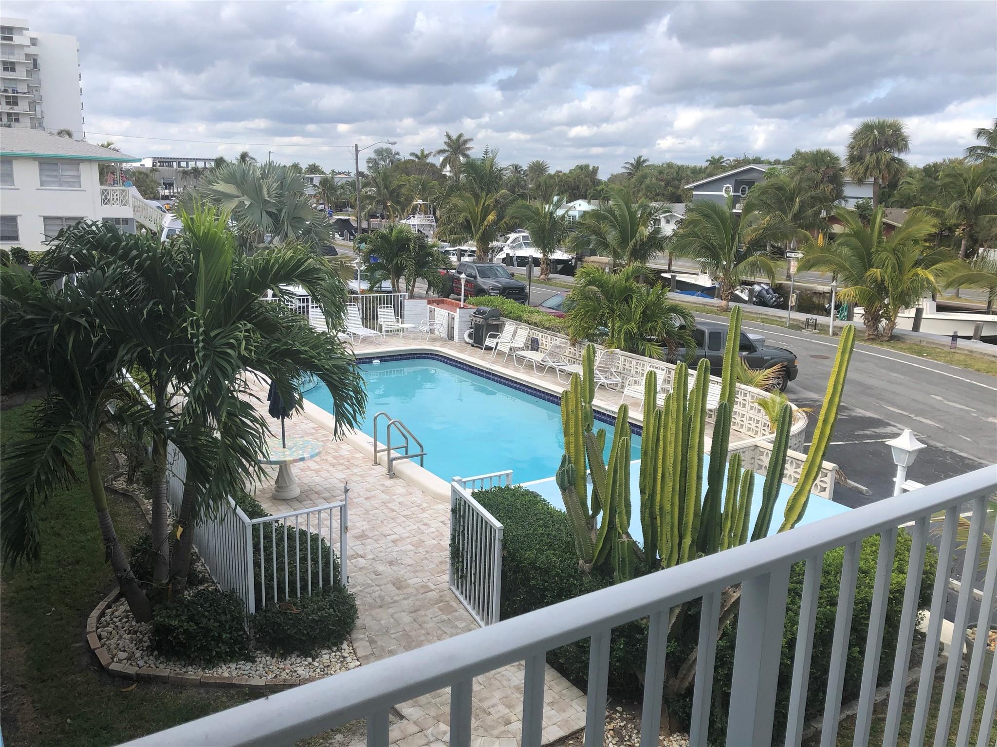 Waterfront property with beach access and beautiful views of the boats and boat docks! No waiting list, act now to be next to get a dock at only $10.50/ft/month! Beautiful updates have been completed with a beach decor. New hot water heater and appliances. Enjoy the pool and cooking grill in a special waterfront setting!