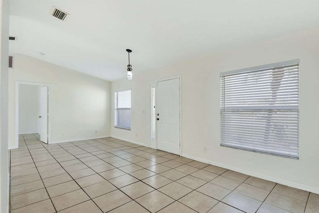 Photo of 1750 SW Buttercup Ave, Port Saint Lucie, FL 34953 (MLS # B26000806)