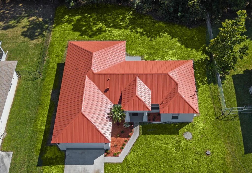 Photo of 1750 SW Buttercup Ave, Port Saint Lucie, FL 34953 (MLS # B26000806)