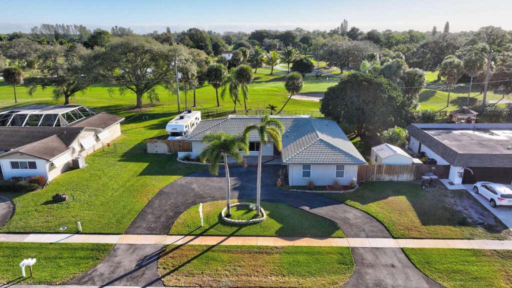 Photo of 3360 Pebble Beach Drive, Lake Worth, FL 33467 (MLS # R11152769)