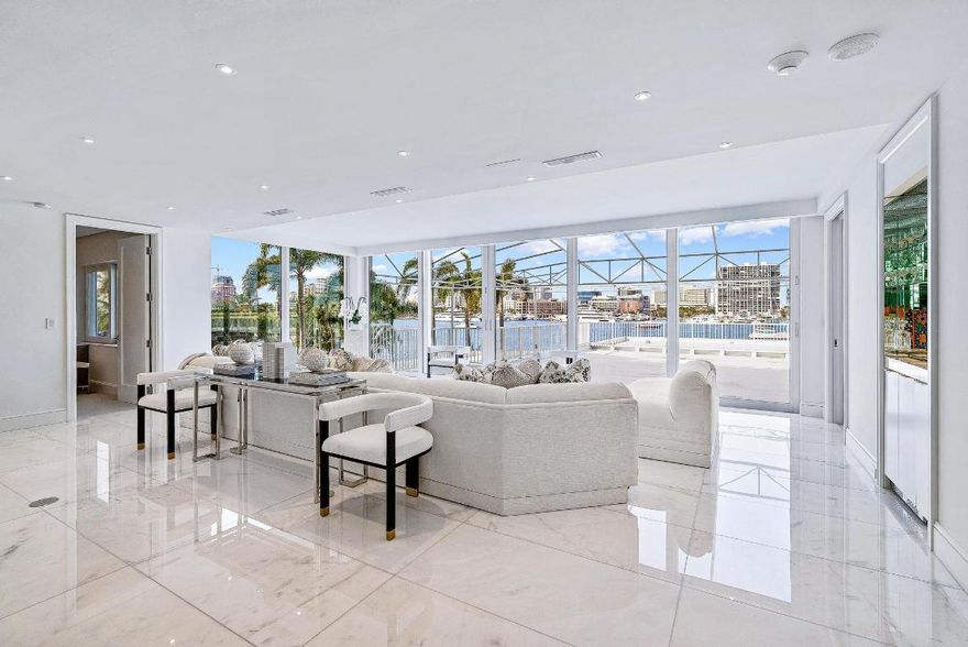 One-of-a-kind Exquisitely Renovated 3 Bedroom 3 ½ Bath Apartment Situated Directly on the Intracoastal. Exceptionally Large Terrace is over 2000 sq. ft. and Affords Panoramic Views from Middle Bridge to North Bridge and Stunning West Palm Beach Skyline and Marina. Custom Millwork and premium appointments throughout include: Lutron Lighting System, Sonos Sound System, Lutron Remote Controlled Shades, Dry Bar, and Separate Laundry Room. No detail has been overlooked. All New Windows and Sliding Glass Doors that open from Living Room to Spectacular Grand Terrace, Perfect for Entertaining. Every Inch is Brand New. This Rare Find is Move-in Perfection at This Newly Reduced Price!