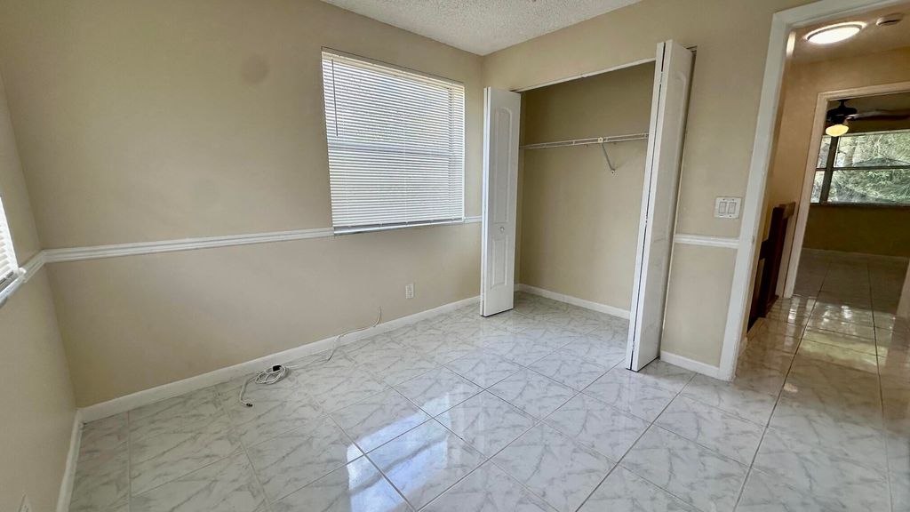 Photo of 1443 NW 94th Way #1443, Coral Springs, FL 33071 (MLS # B26008466)