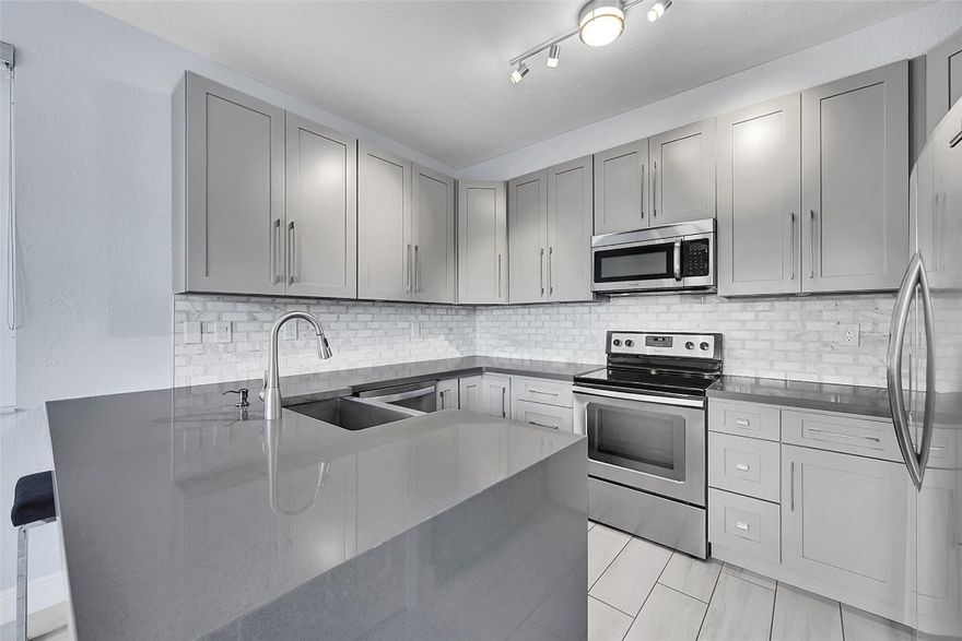 This turn-key two-story townhouse condo is in the heart of Plantation. This is your opportunity to own a beautifully updated corner-unit townhouse in the highly sought-after, gated community of Courtyards at Jacaranda. Step inside to an inviting open floor plan that seamlessly connects the gourmet kitchen, dining room, & spacious living area -perfect for entertaining. Enjoy serene lake views from your dining area with direct access to a private patio. Downstairs features a convenient half bathroom & in-unit washer & dryer. Upstairs, you’ll find two master bedrooms (one larger), each with walk-in closets & fully renovated bathrooms. Additional upgrades include impact windows on the second floor, shutters on the first, & a new hot water heater for peace of mind. Two assigned parking spots.