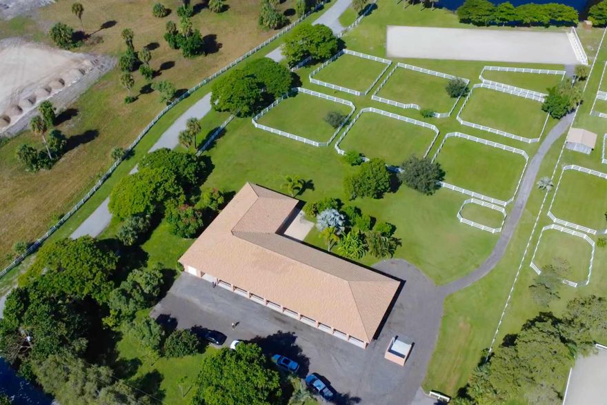 Move-in ready, turnkey 5 acre farm in White Fences.  Brand new JTWG fiber arena with new mirror and irrigation pump. This CBS barn is a breezy beauty with 14 stalls (2 stallion) with 4 washstalls, mats and fly spray system, 8 large paddocks with new fencing, large a/c tack room, feed room and additional storage room, full barn bathroom and barn laundry. New well and RO system. Apartment has large open plan kitchen/dining area, with two bedrooms, and a shared full bathroom. Entrance is either via the barn, with two large laundry/cleaning storage rooms, or via the sunny French door facing the paddocks. Spacious asphalt parking/delivery area for plenty of cars and trailers, bridle path to arena. White Fences is a gated equestrian community with miles of trails. Located 10 miles north of WEF