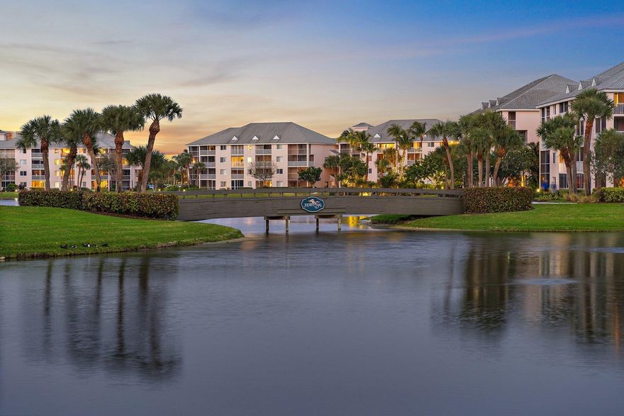 Seldom available, 1st & 2nd floor, TOWNHOUSE Style end-unit condo in Jupiter Bay residents enjoy a Tropical Resort Lifestyle! Completely updated 2 Bedroom, 2.5 Bath with magnificent views of lake, waterfall & community. 1st-floor Living Space and retire to the 2nd-floor bedrooms from the interior stairs or off the elevator! Elegant beach vibe, sunny 1st floor side patio plus the screened in patio off the Living Room. Enjoy 2 swimming pools, hot tub, tennis, bocci ball & walking/bicycling around the community! Carlin Park, Ocean Beach & Intracoastal, Restaurants, Shopping & The Theatre within walking distance! Two great restaurants are located on property: Portobellos & Twisted Tuna. Rent your unit for as few as 30 days! Pets allowed <20 LBS. Recent upgrades NEW AC 2023, Water Heater 2026.